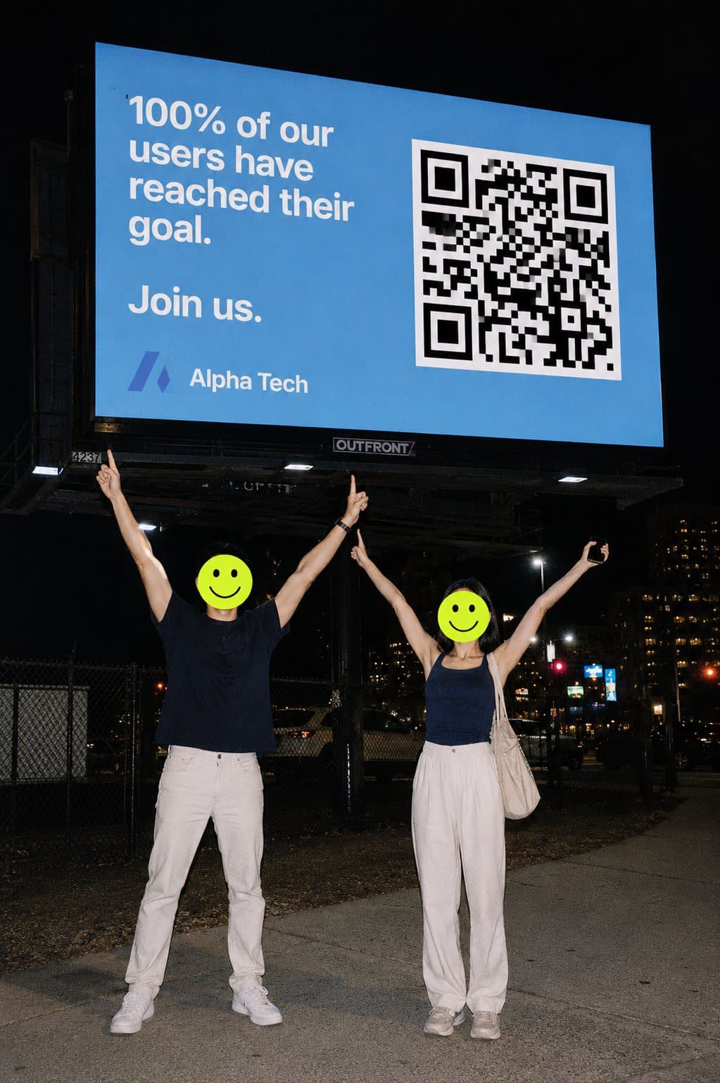 Two founders pointing at their company on a billboard at night